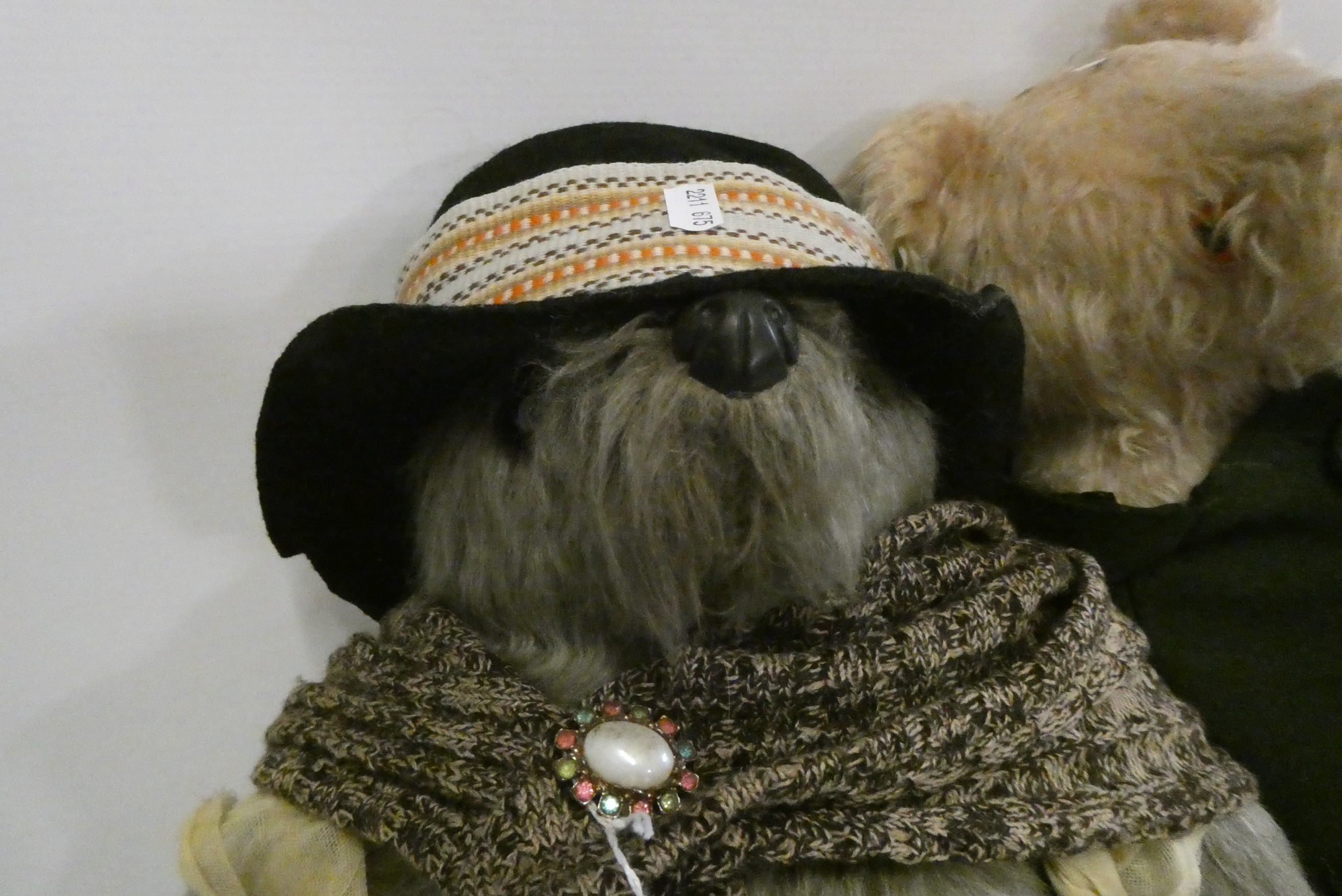 Paddington and an Aunt Lucy Bear, Paddington in a Green felt coat and red Dunlop boots, Lucy with Image