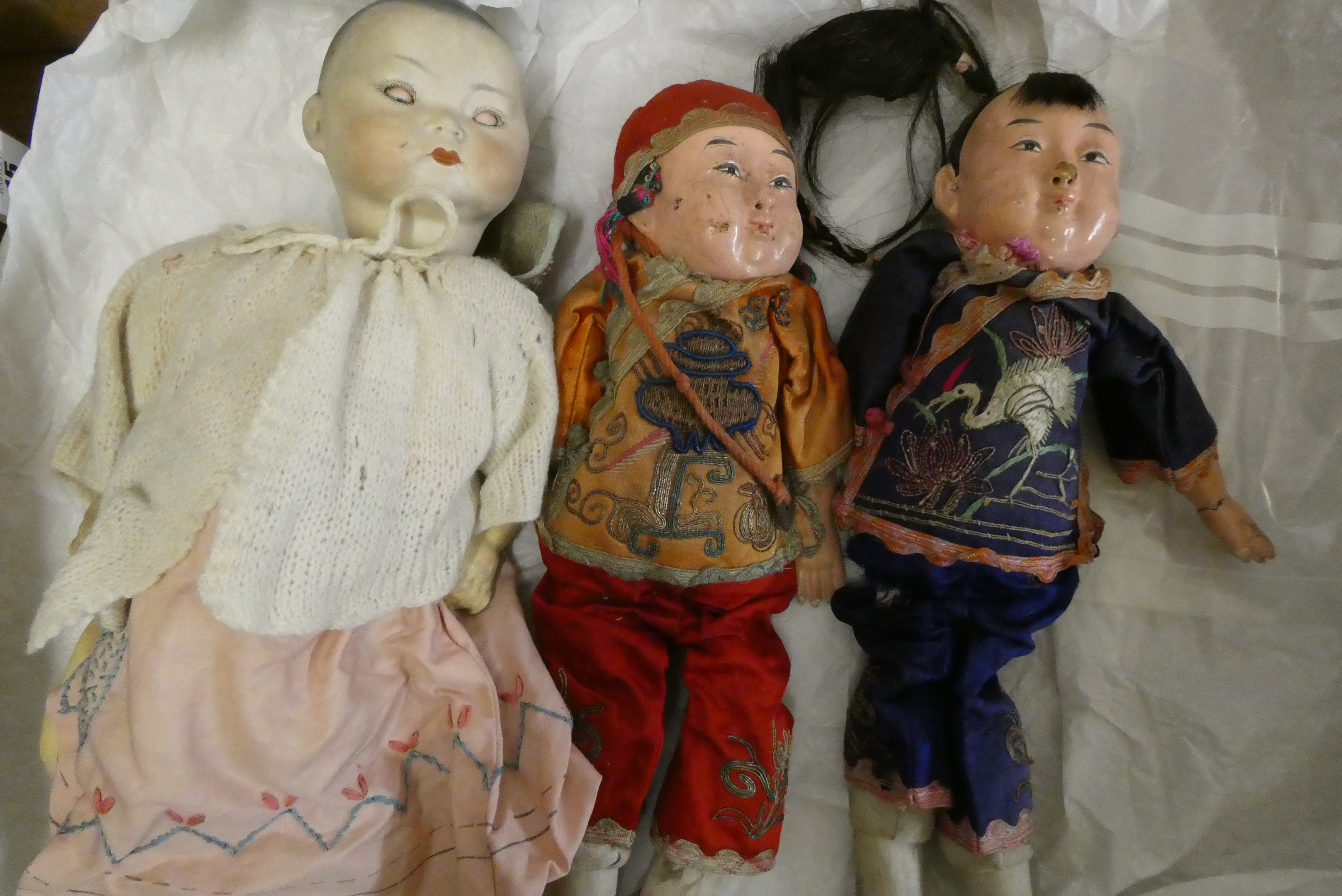 3 vintage oriental dolls, comprising one German bisque socket head example numbered 2 and two all Image