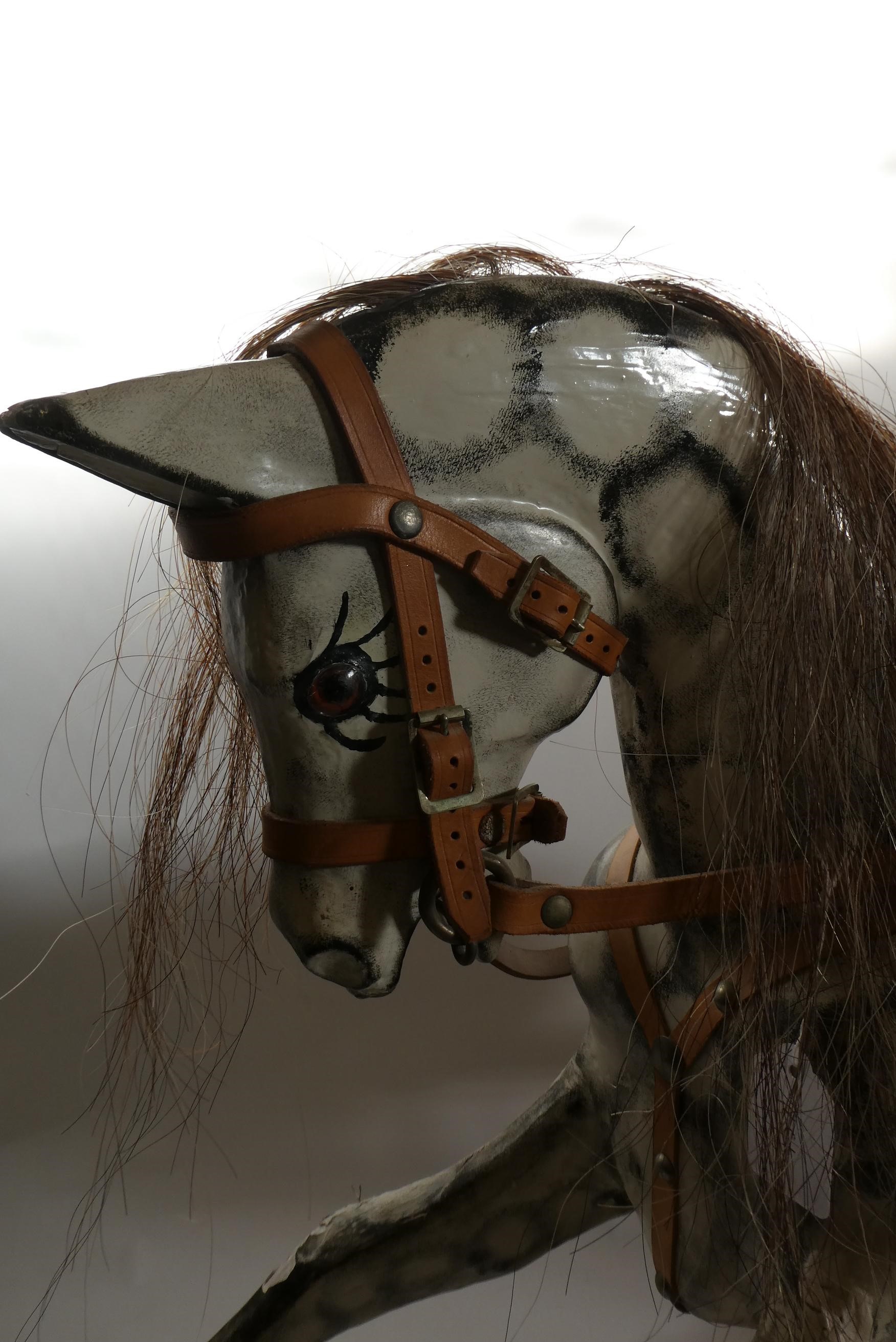 Vintage rocking horse, wooden body, glass eyes, dappled grey paint, horse hair mane and tail, Image