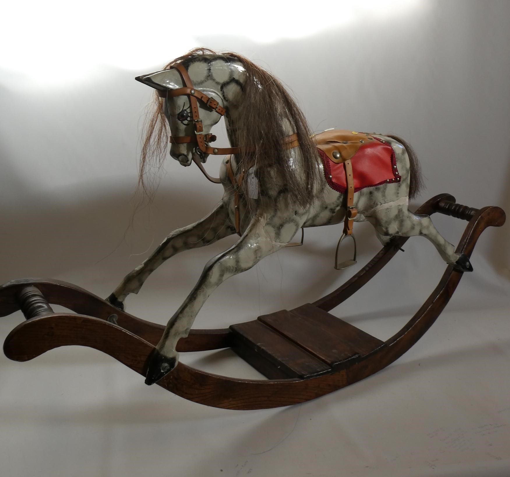 Vintage rocking horse, wooden body, glass eyes, dappled grey paint, horse hair mane and tail, Image
