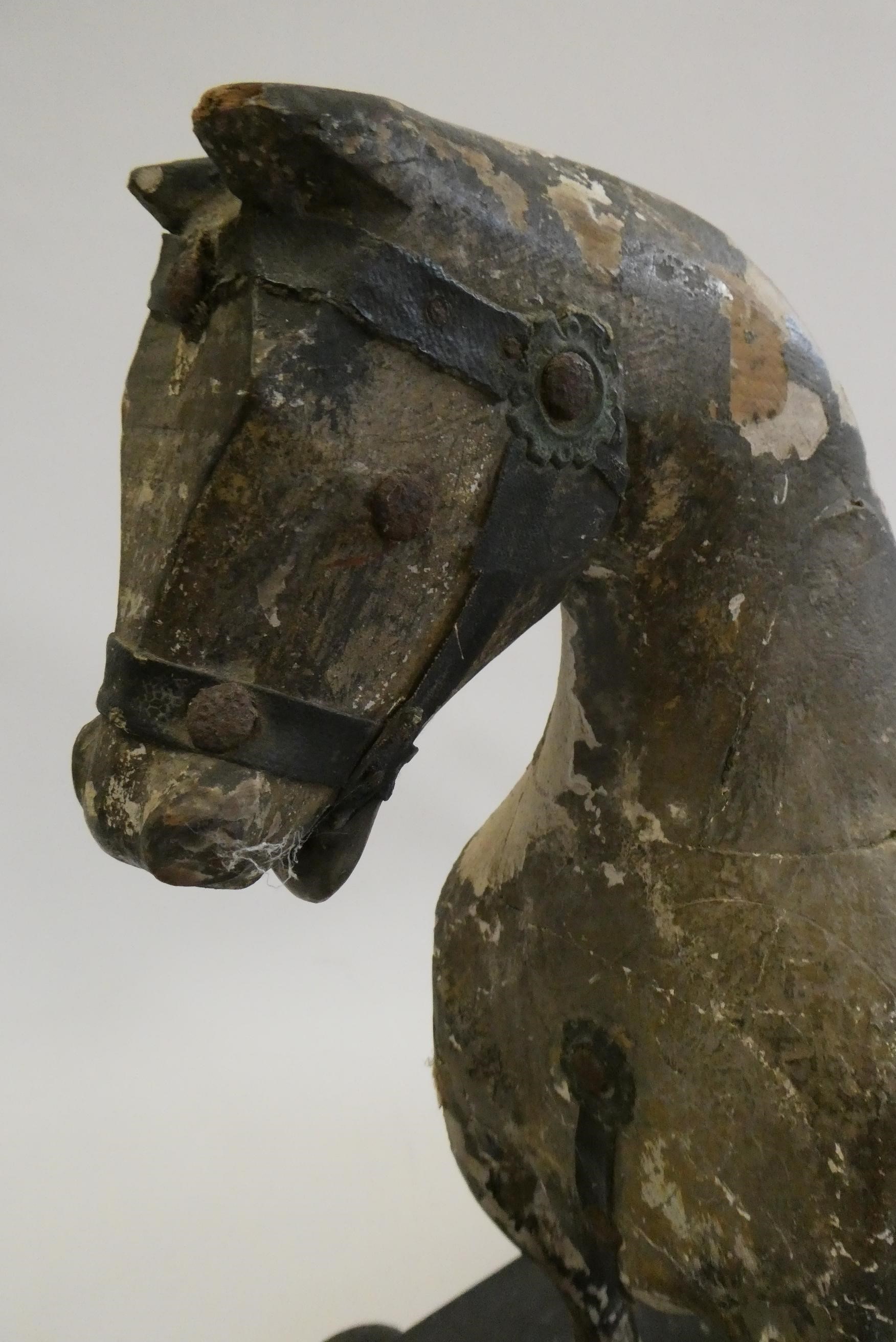 An antique carved wood pull-a-long horse, with horse hair tail, wooden base and metal wheels, 23 Image