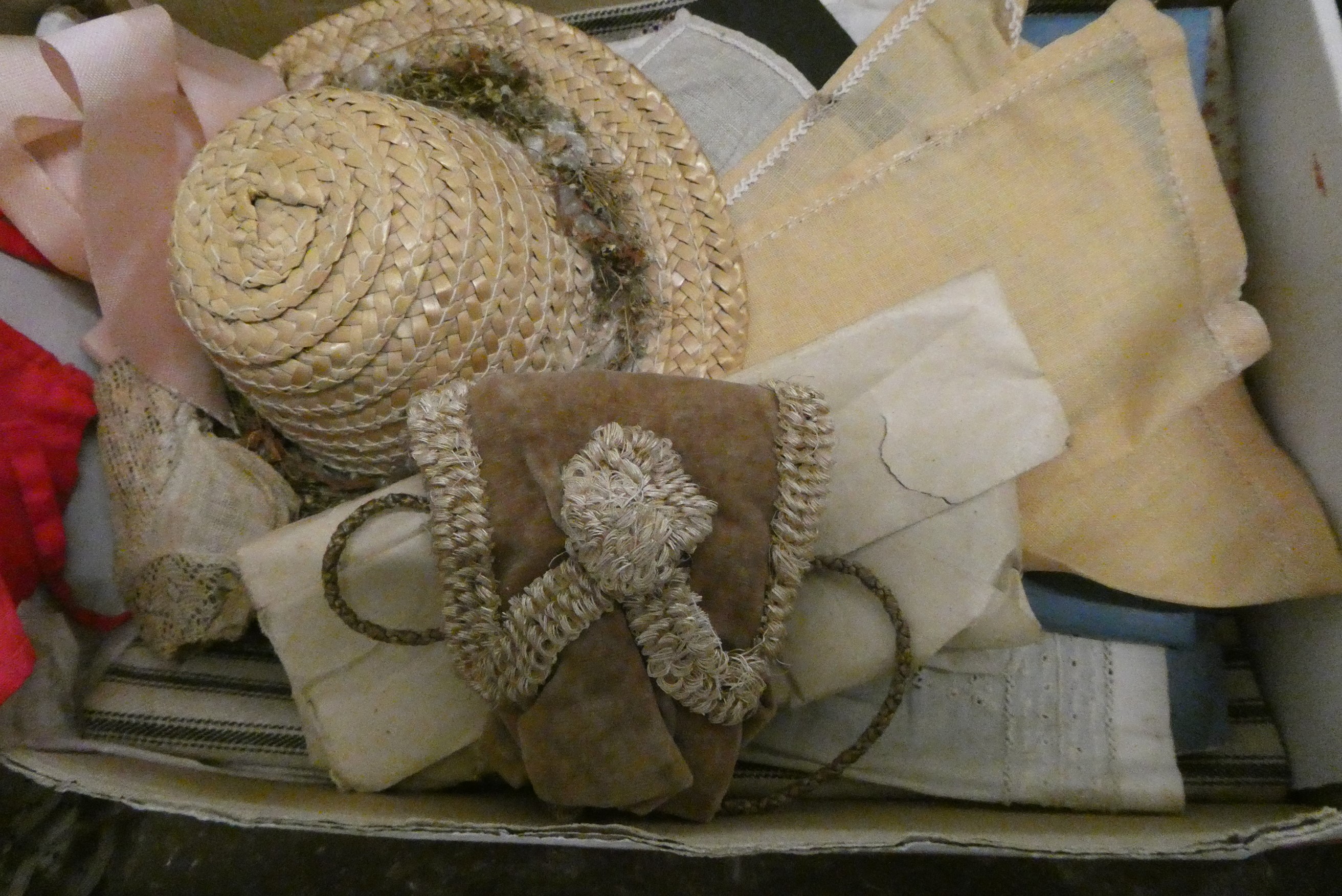 Box of good quality antique dolls clothes and accessories, including shoes and hats Image