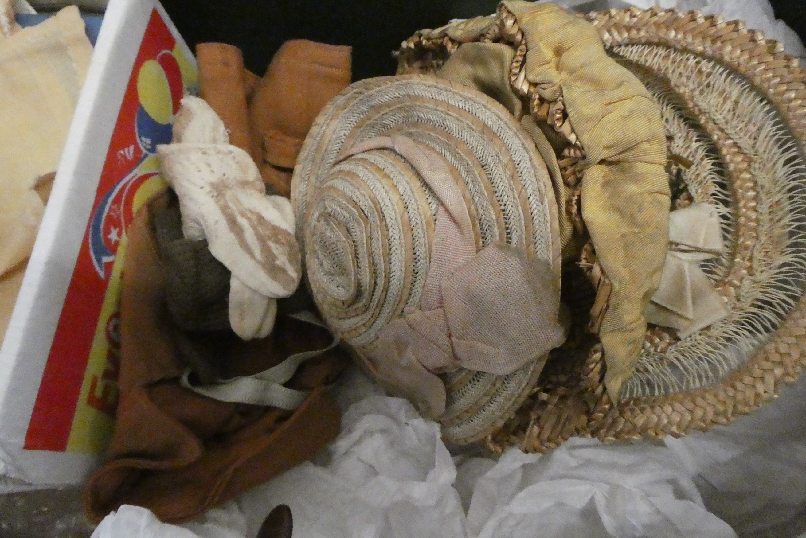 Box of good quality antique dolls clothes and accessories, including shoes and hats Image