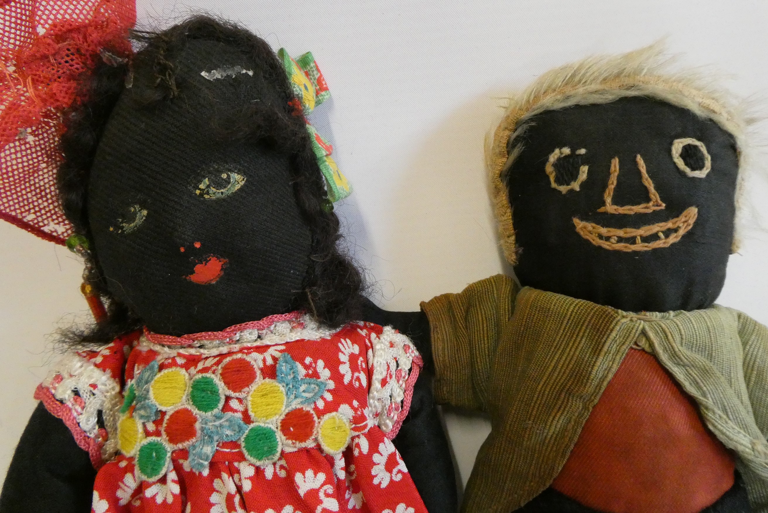 Two folk art vintage dolls, one with painted features, the other sewn, both in original clothing, Image