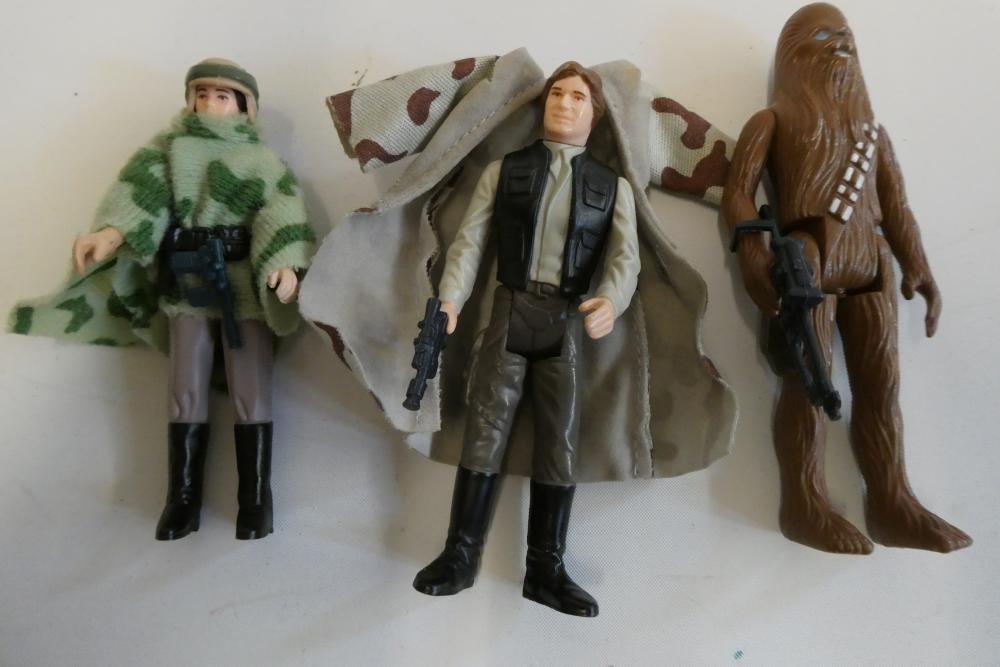 3 Star Wars figures, comprising Princess Leia Organa in comba poncho, Hans Solo in trench coat and Image