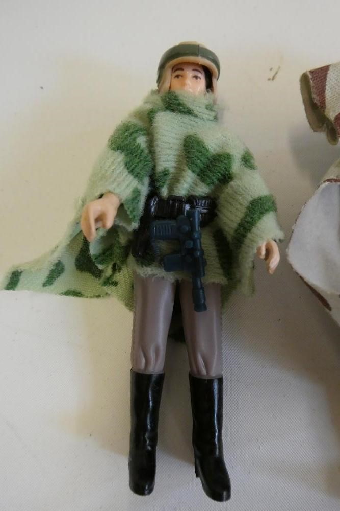3 Star Wars figures, comprising Princess Leia Organa in comba poncho, Hans Solo in trench coat and Image