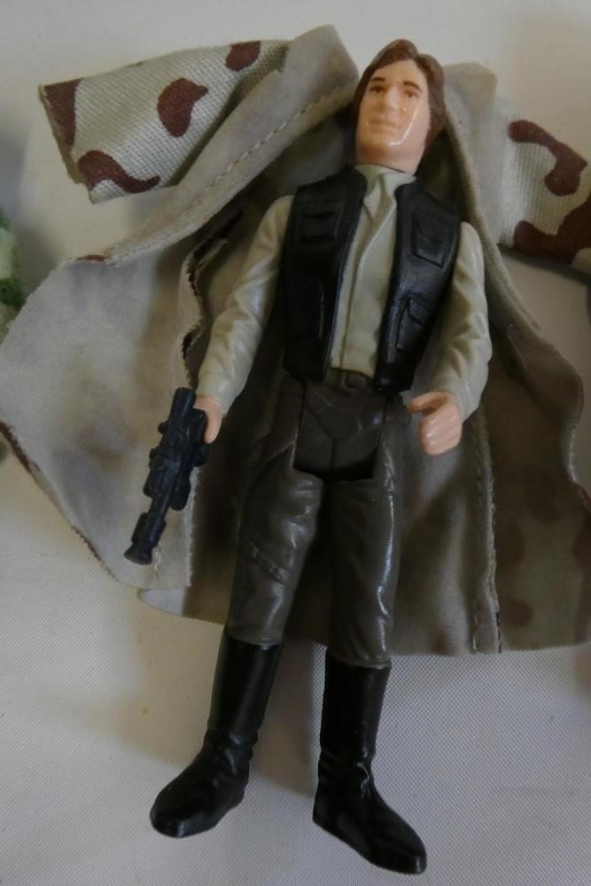 3 Star Wars figures, comprising Princess Leia Organa in comba poncho, Hans Solo in trench coat and Image