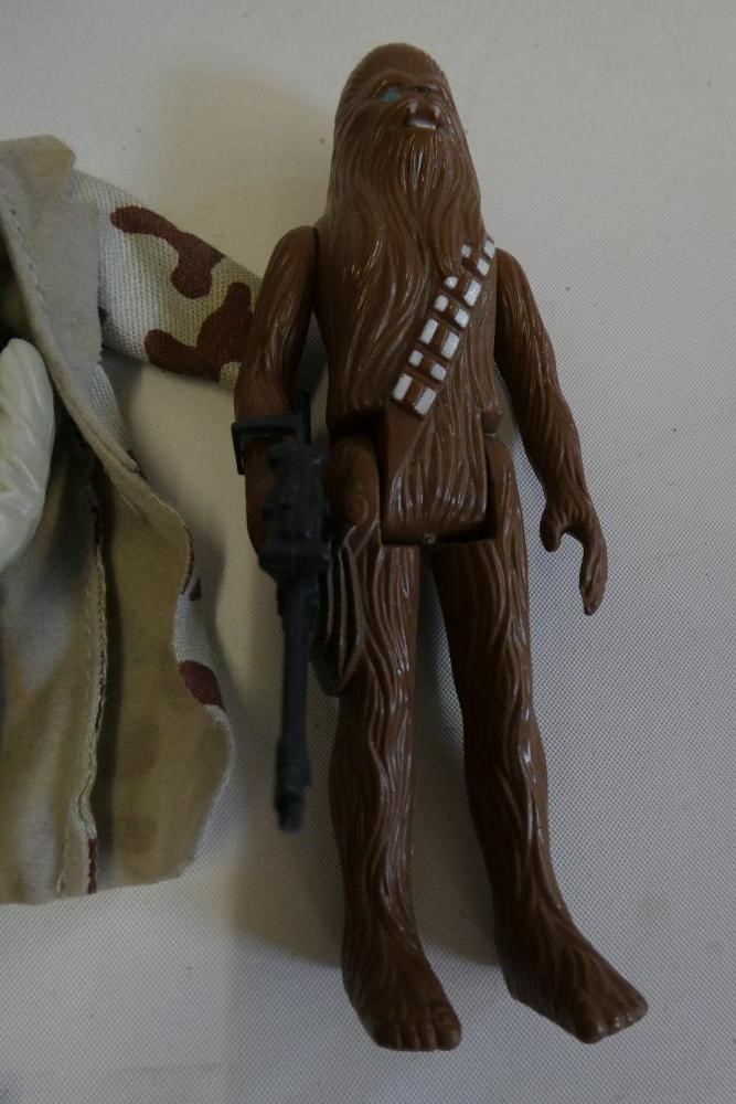 3 Star Wars figures, comprising Princess Leia Organa in comba poncho, Hans Solo in trench coat and Image