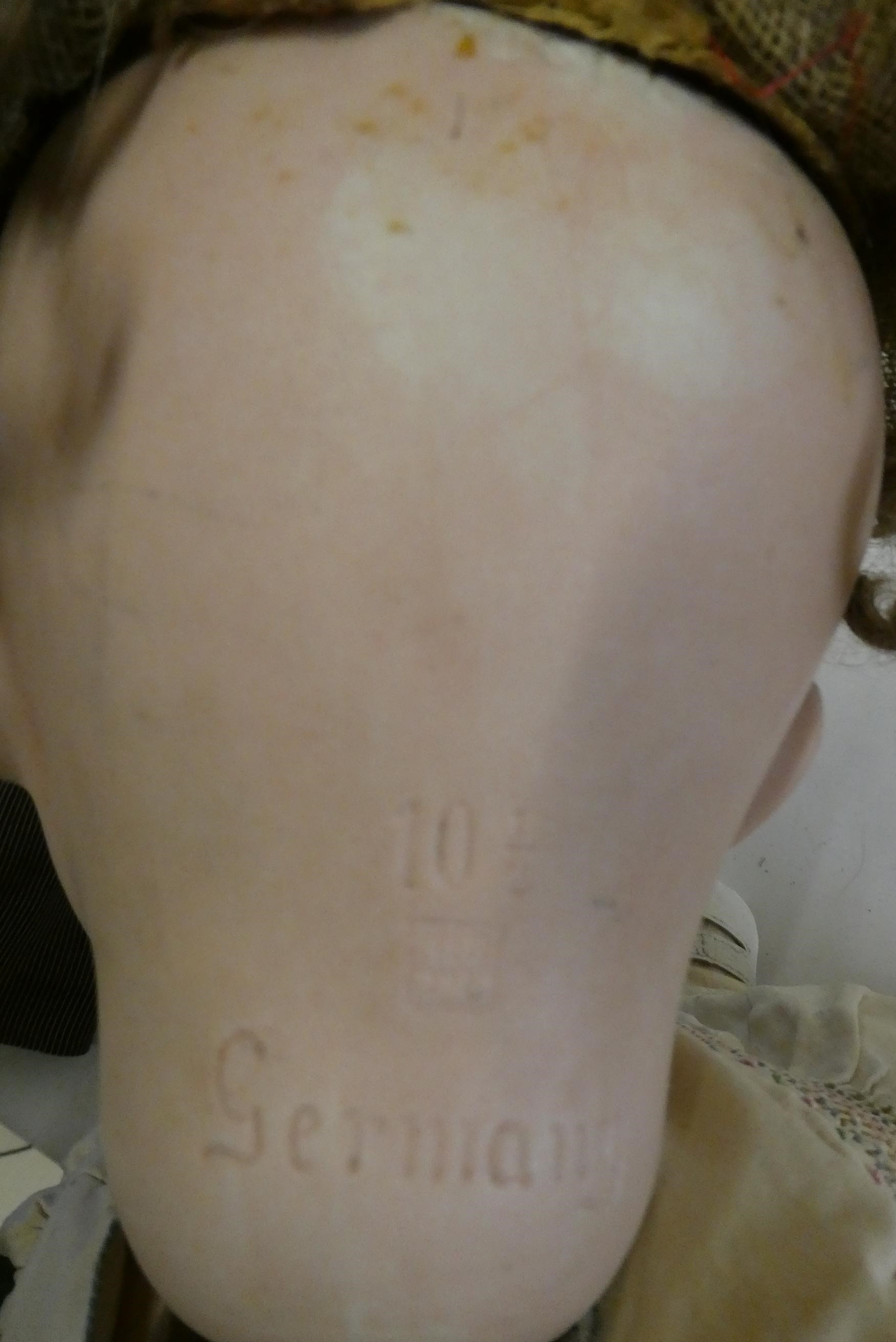 A Heubach bisque socket head doll, with blue glass sleeping eyes, open mouth, teeth, tongue, bent Image