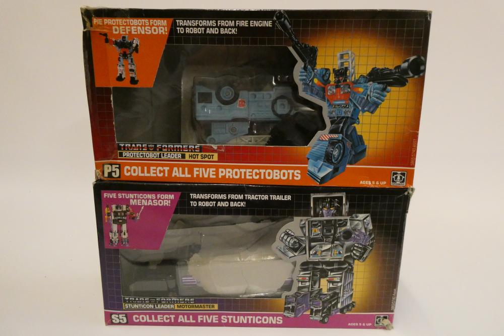 Two boxed Transformers, comprising Stunticon Leader Motormaster and Protectobot Leader Hot Spot, Image