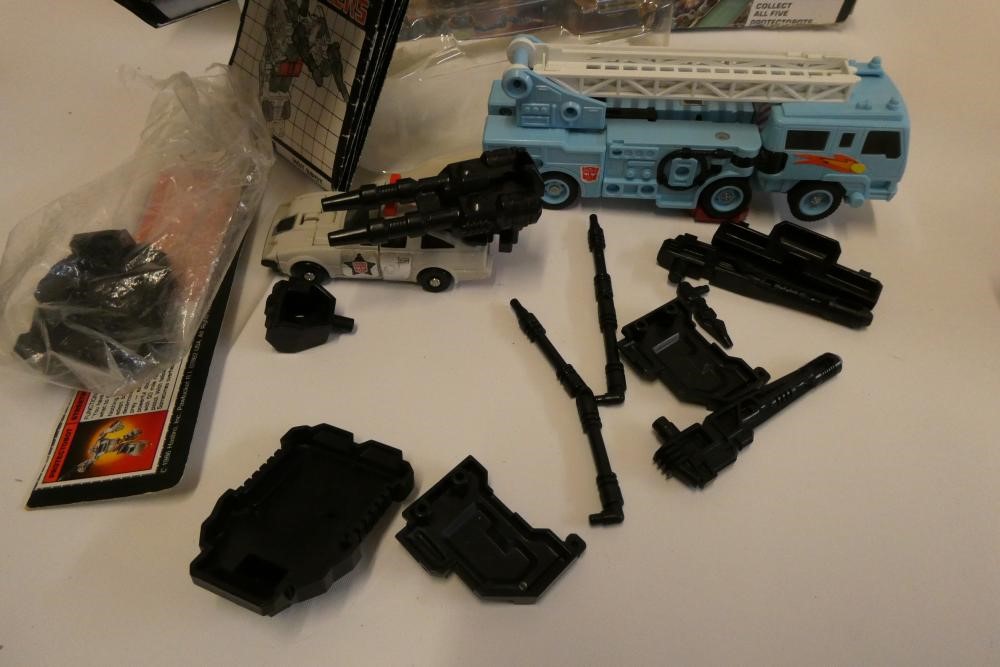 Two boxed Transformers, comprising Stunticon Leader Motormaster and Protectobot Leader Hot Spot, Image