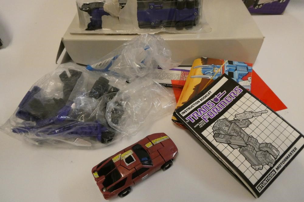 Two boxed Transformers, comprising Stunticon Leader Motormaster and Protectobot Leader Hot Spot, Image