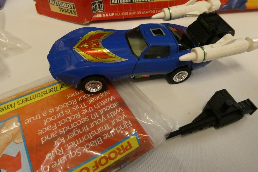 Two boxed Transformers, comprising Duocon Flywheels and Autobot Warrior Tracks, figures fair, box af Image