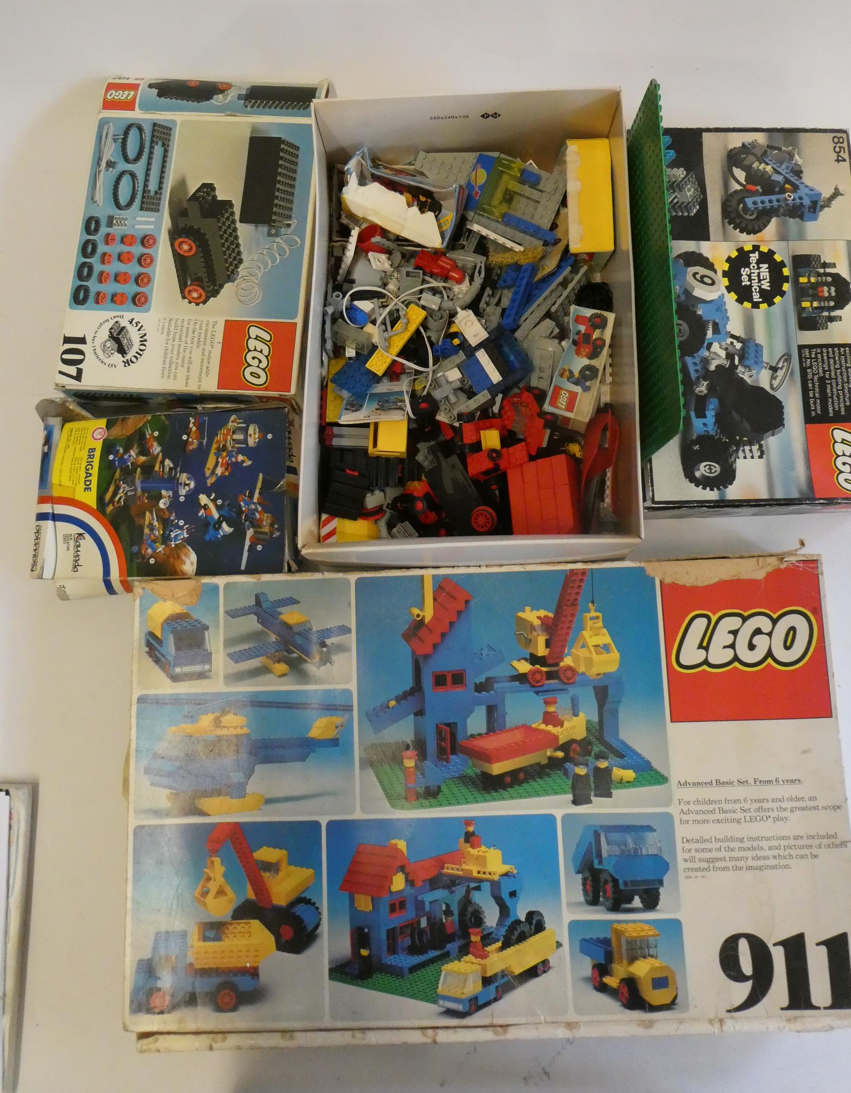 A box of vintage Lego, including sets 854, 107, 911 and other loose parts, completeness unchecked, Image