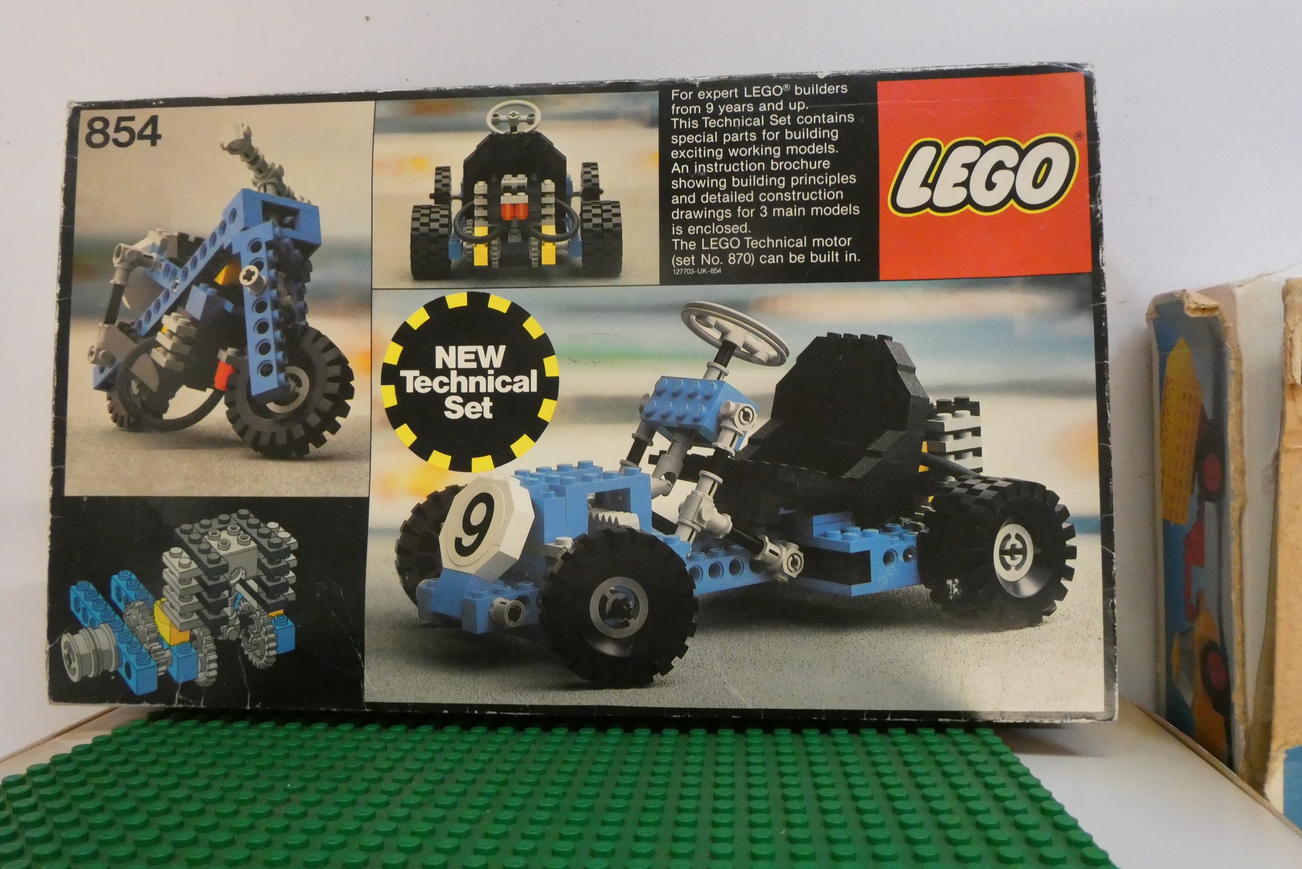 A box of vintage Lego, including sets 854, 107, 911 and other loose parts, completeness unchecked, Image