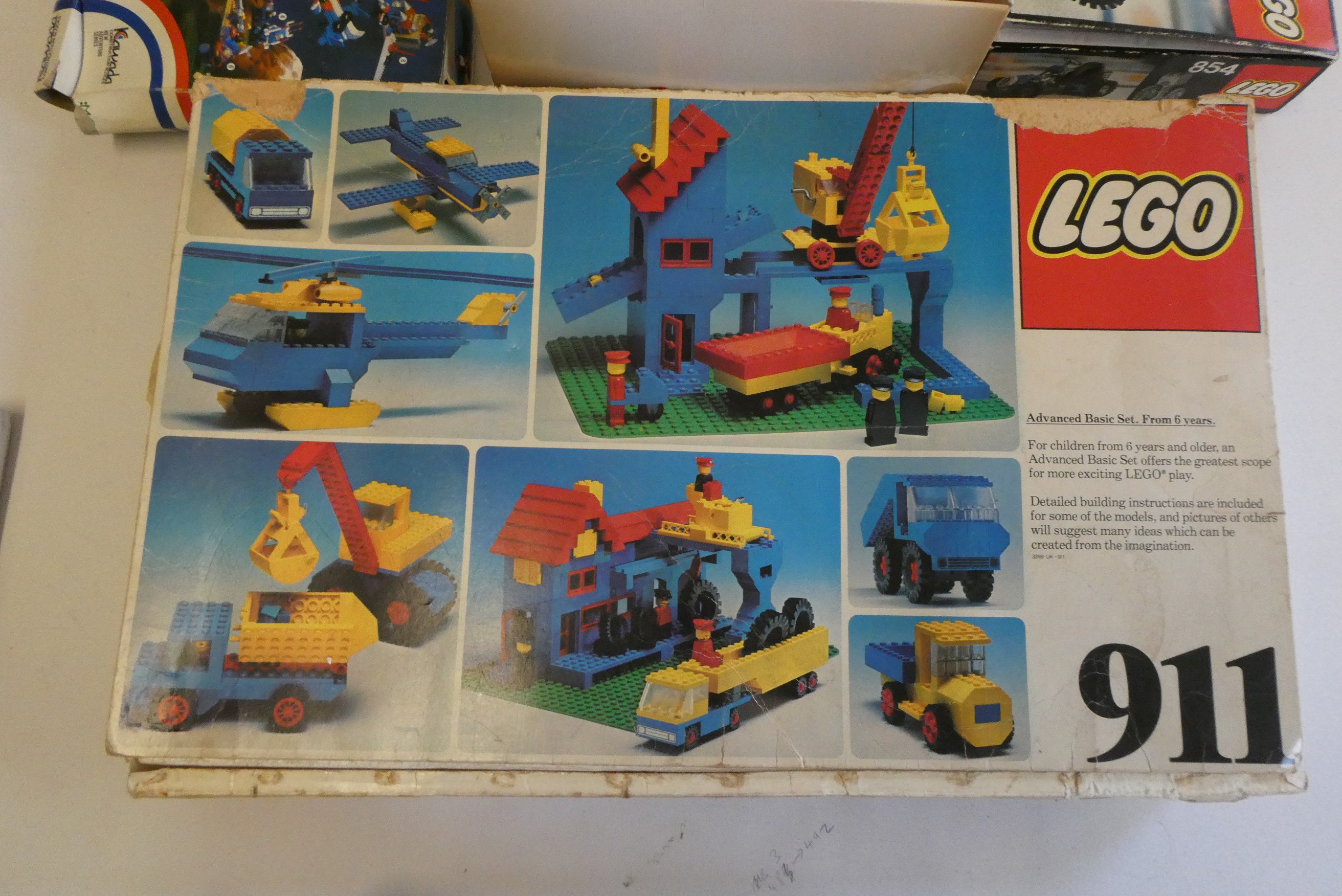 A box of vintage Lego, including sets 854, 107, 911 and other loose parts, completeness unchecked, Image
