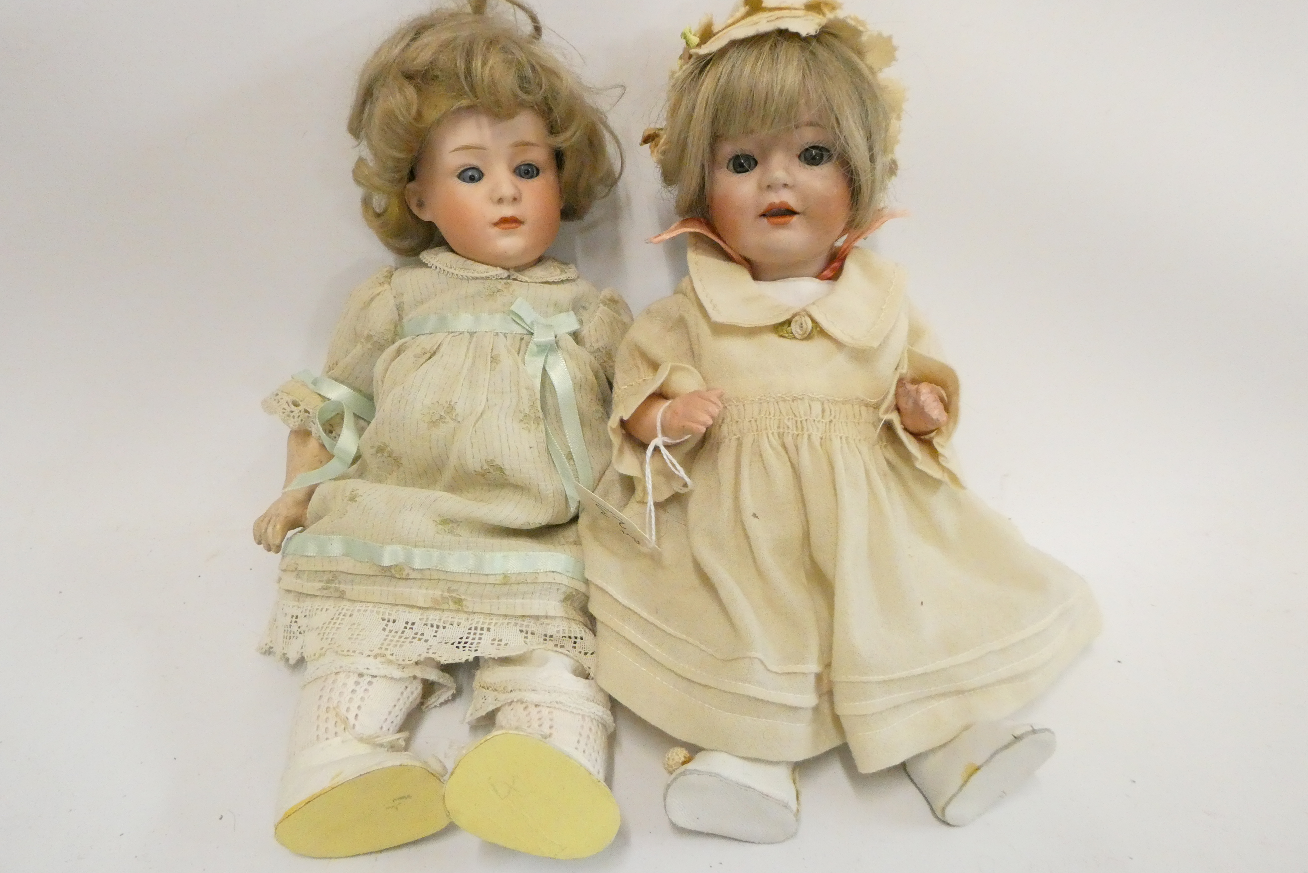 Two Heubach socket head dolls, one 11 1/2" 6970 doll with sleeping eyes, closed mouth and fixed Image