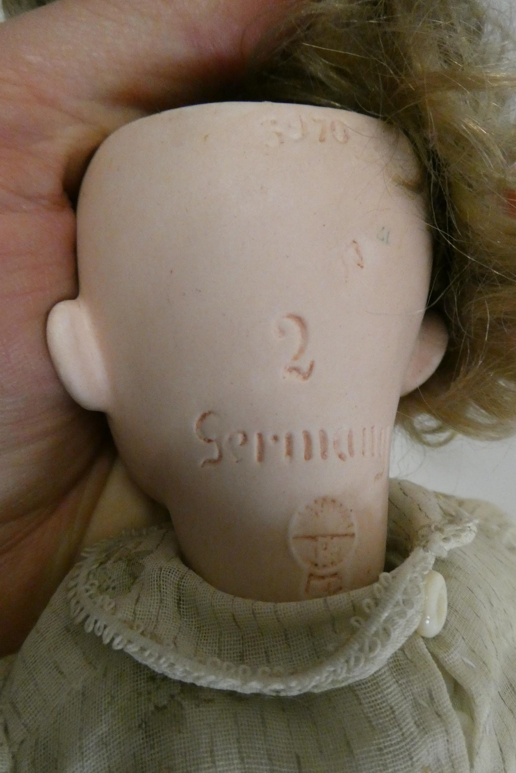 Two Heubach socket head dolls, one 11 1/2" 6970 doll with sleeping eyes, closed mouth and fixed Image