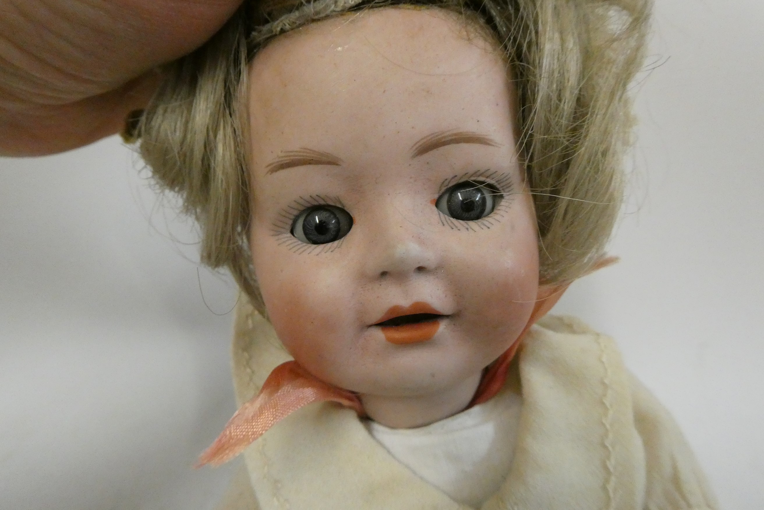 Two Heubach socket head dolls, one 11 1/2" 6970 doll with sleeping eyes, closed mouth and fixed Image
