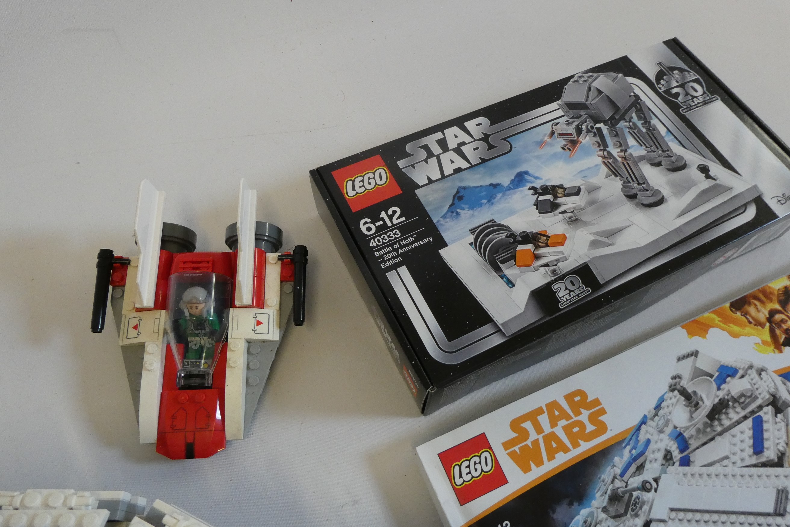 A box of Star Wars Lego, including set 75212 (unboxed and unchecked), set 40333 unopened and another Image