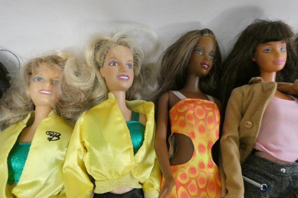 A box of Barbie accessories, Ken dolls, two Sindy dolls and Hasbro celebrity dolls etc, including a Image