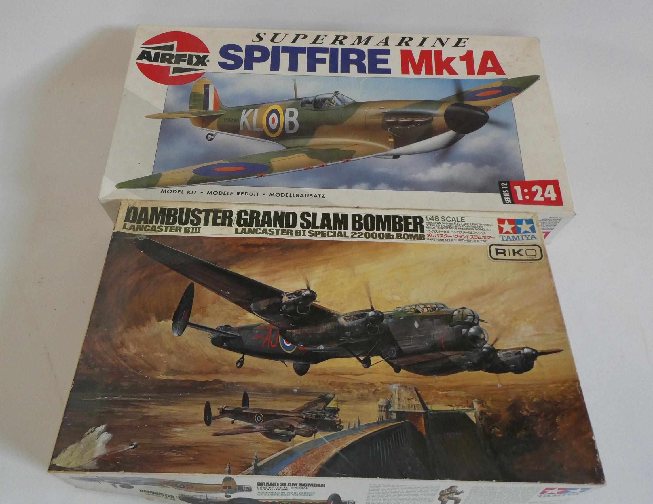Two plastic aircraft kits comprising Airfix 1/24th scale Spitfire (started) and Tamiya 1/48 scale Image