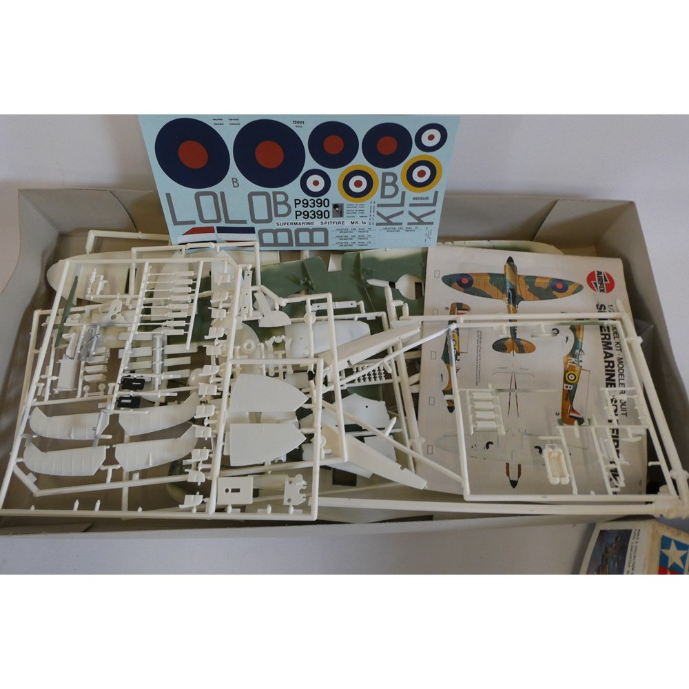 Two plastic aircraft kits comprising Airfix 1/24th scale Spitfire (started) and Tamiya 1/48 scale Image