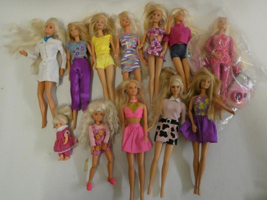 Twelve Barbie dolls, comprising ten Barbies, two younger sisters and a Barbie camera Image