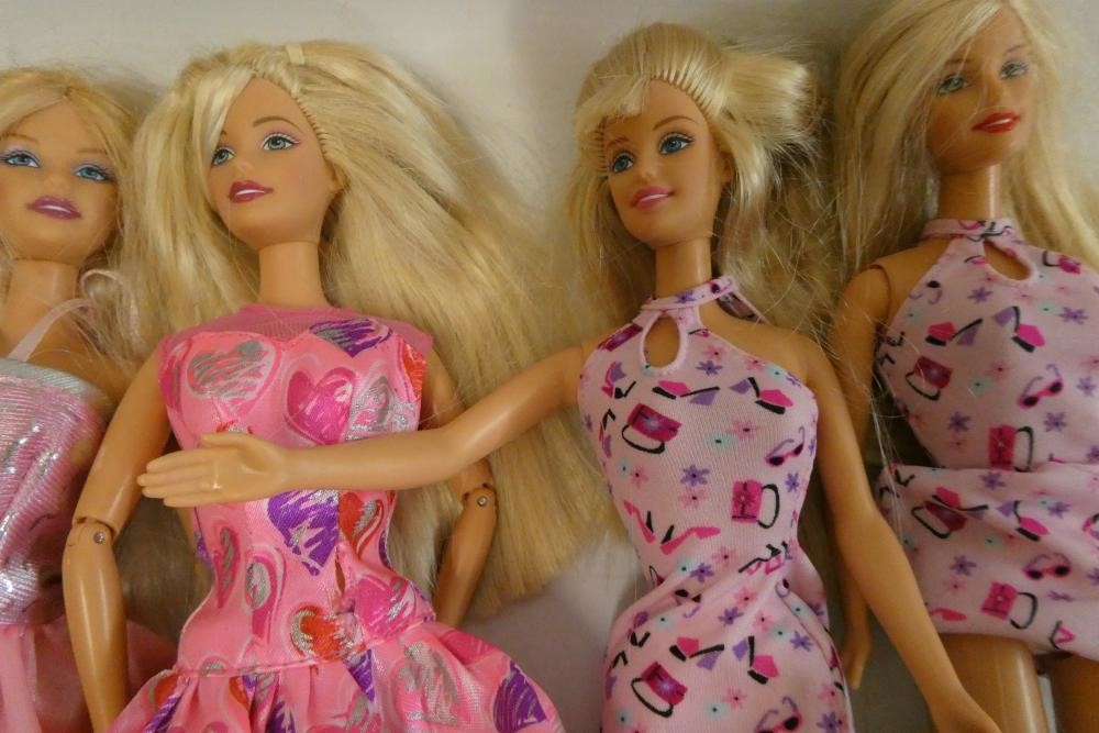 Twelve Barbie dolls, comprising one Mattel 1983 Ken and eleven later Barbies Image
