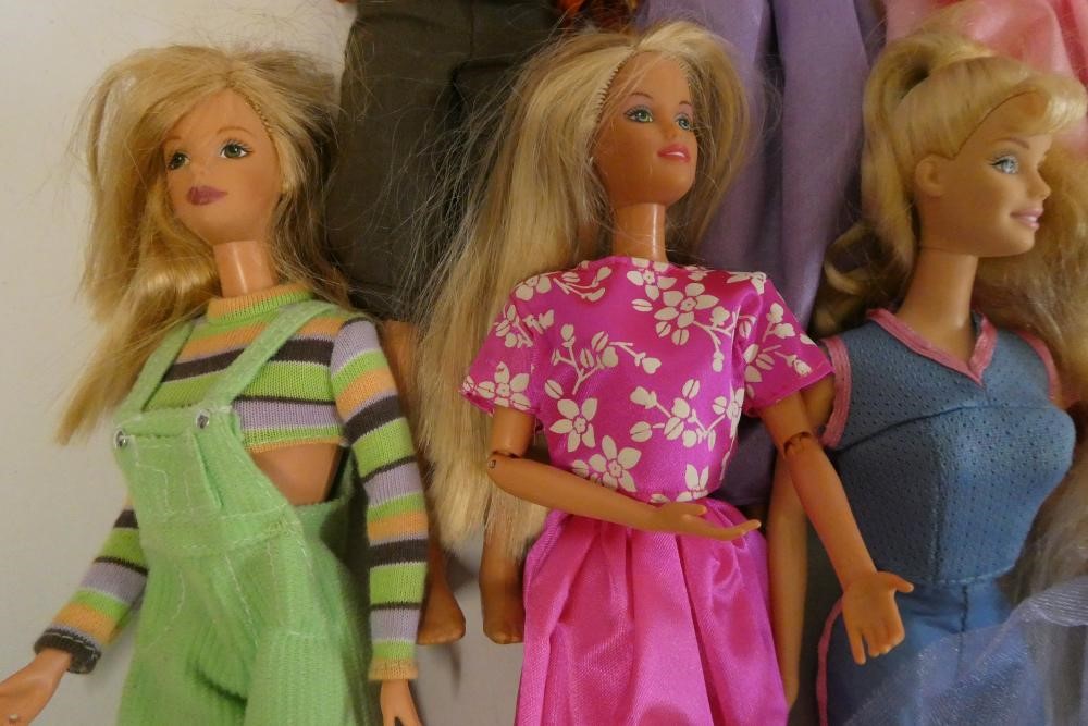 Twelve Barbie dolls, comprising one Mattel 1983 Ken and eleven later Barbies Image