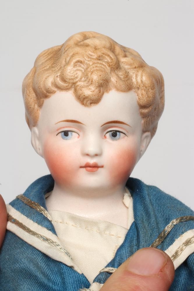 A fine Simon & Halbig bisque shoulder head sailor boy doll, with moulded hair, painted features, Image