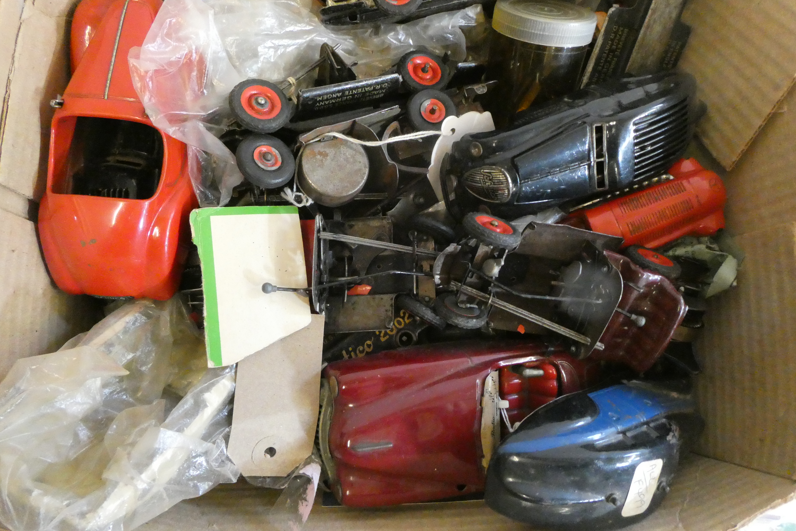 Playworn and damaged Schuco clockwork cars, some items have been completely disassembled, others Image