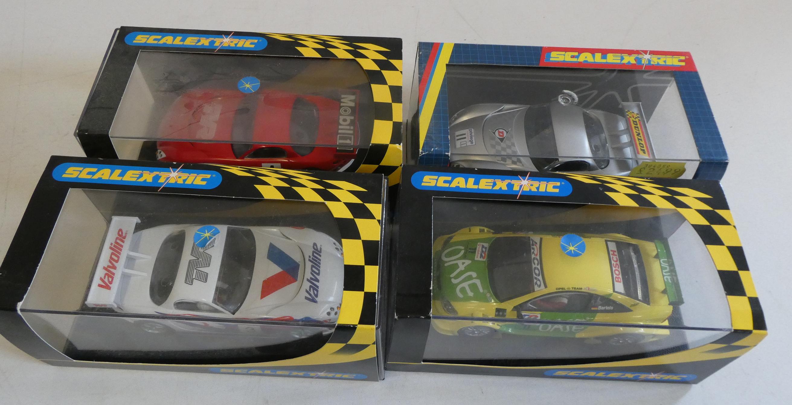 Four Scalextric saloon race cars comprising three TVRs and Opel V8 coupe, all items boxed Image