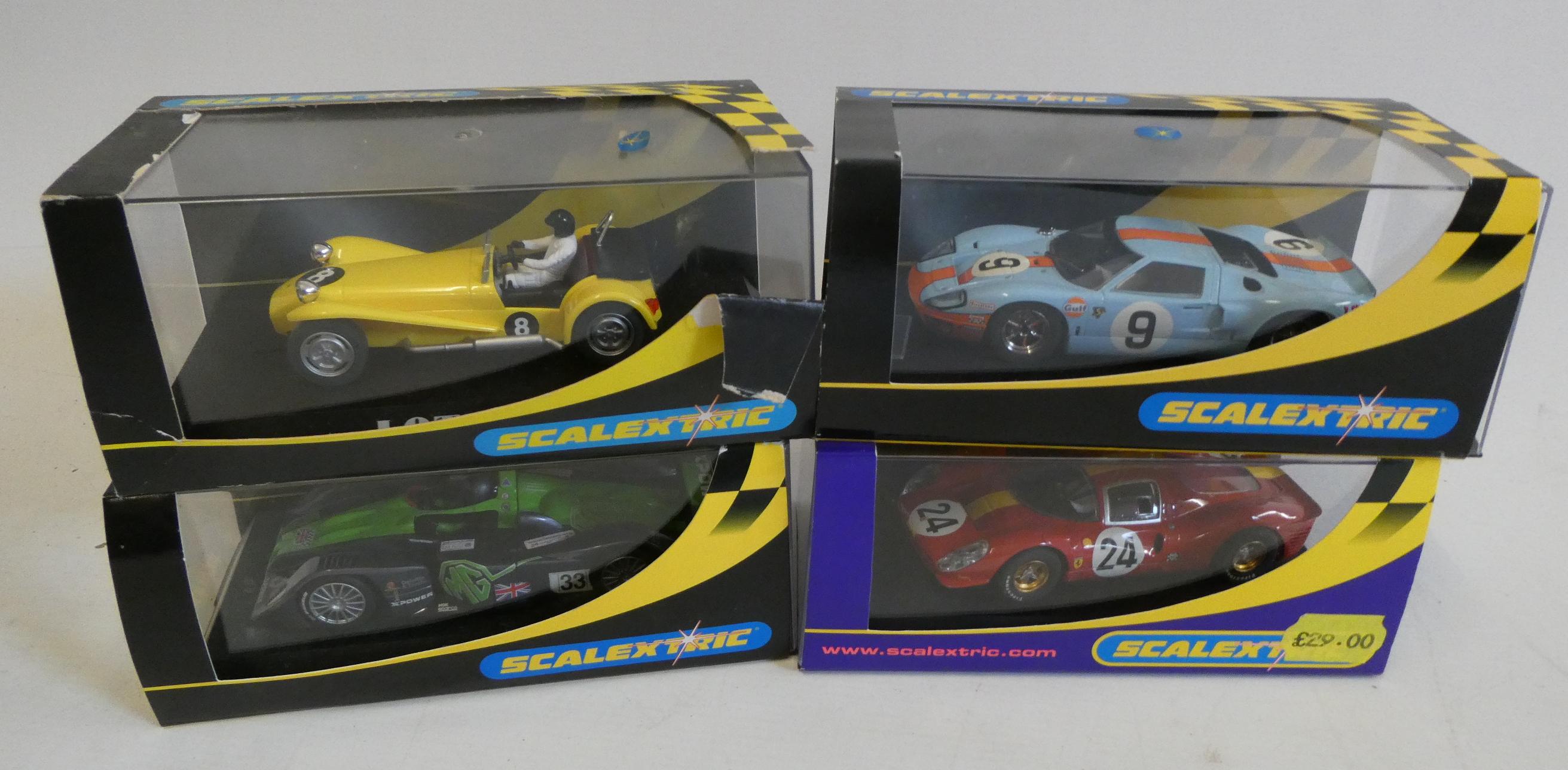 Four Scalextric cars comprising Ford GT40, Ferrari 330 and MG Lola, all items boxed, excellent Image