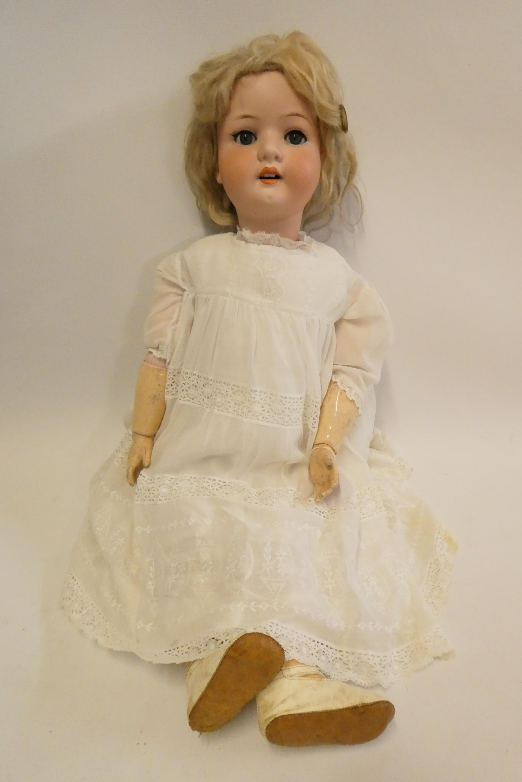 A Heubach Koppelsdorf bisque socket head doll, with blue glass sleeping eyes, open mouth, teeth, Image