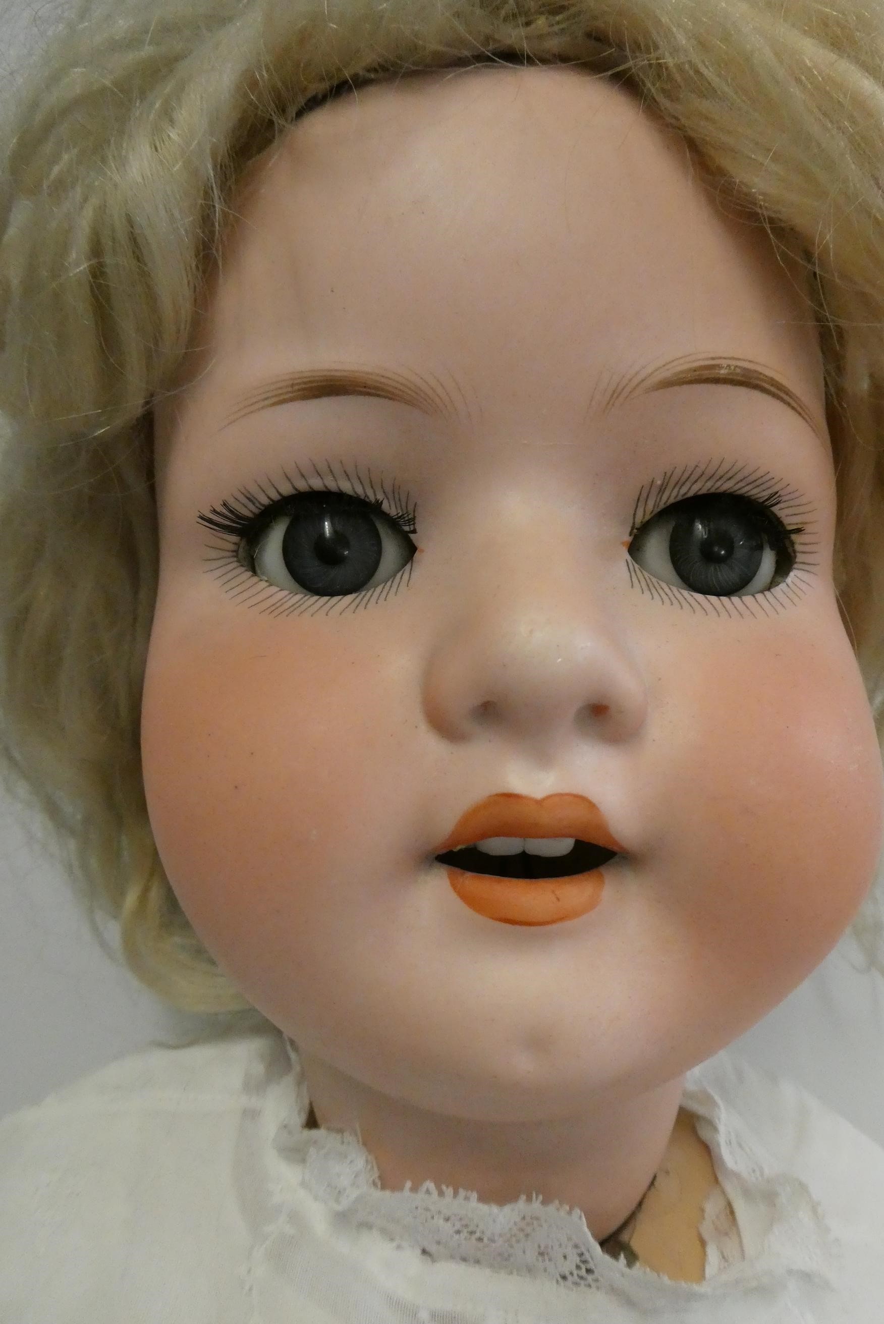 A Heubach Koppelsdorf bisque socket head doll, with blue glass sleeping eyes, open mouth, teeth, Image