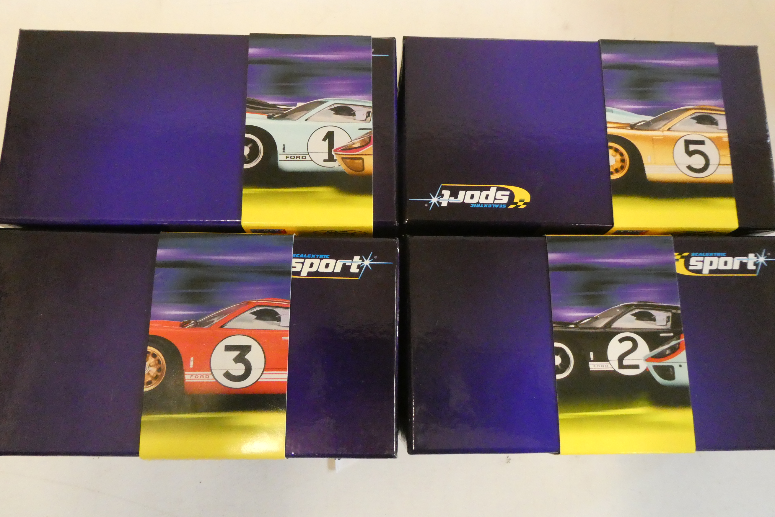 Four Scalextric Ford GT 40s comprising 1966 in Ford blue, 1966 in red, 1966 in black and 1966 in Image