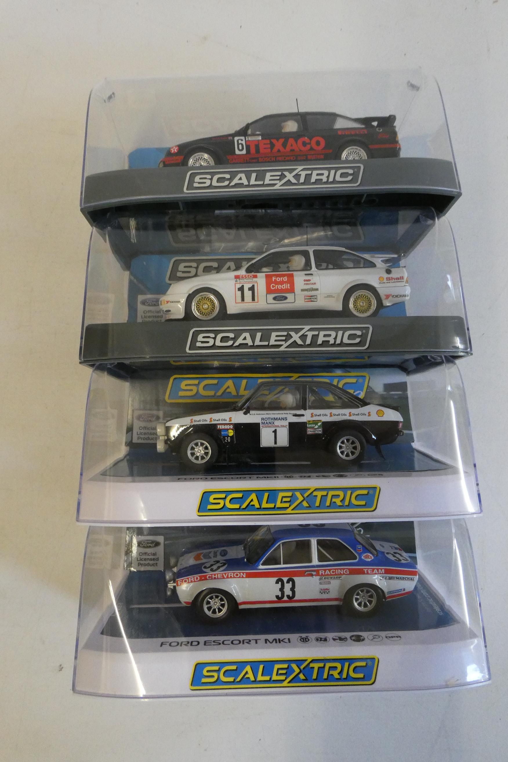 Four Scalextric cars comprising two Ford Sierra RS500, Ford Escort and MK2 Ford Escort MK1, all Image