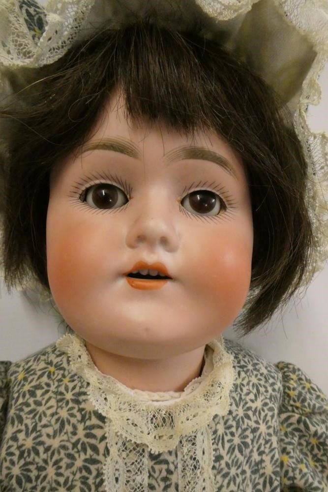 A Schoenau & Hoffmeister bisque socket head doll Image