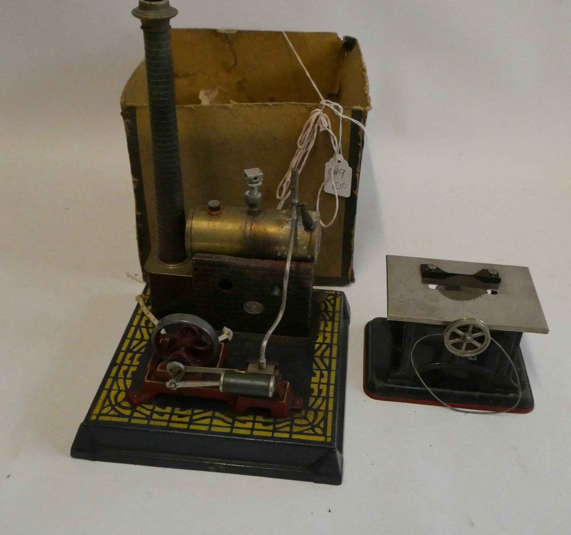 Plank stationary steam engine, number 350, box at fault, model fair and a small table saw accessory Image