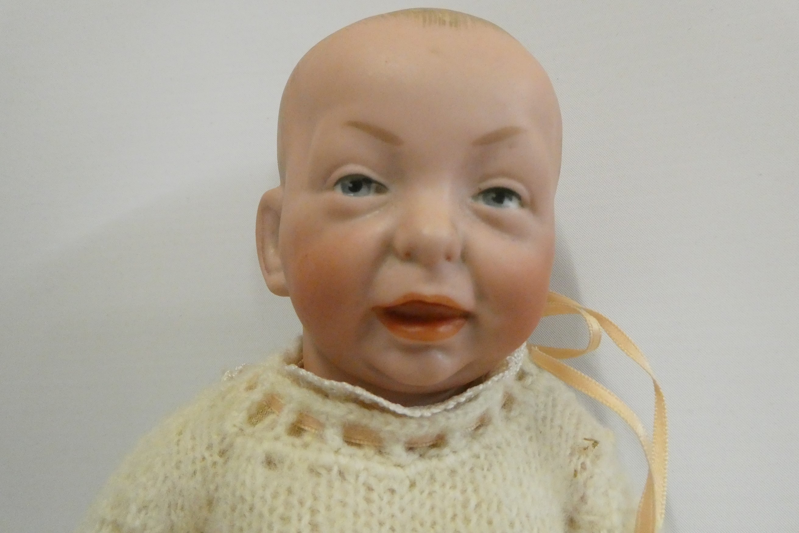 A Kammer & Reinhardt bisque socket head character doll, with painted features, bent limb composition Image