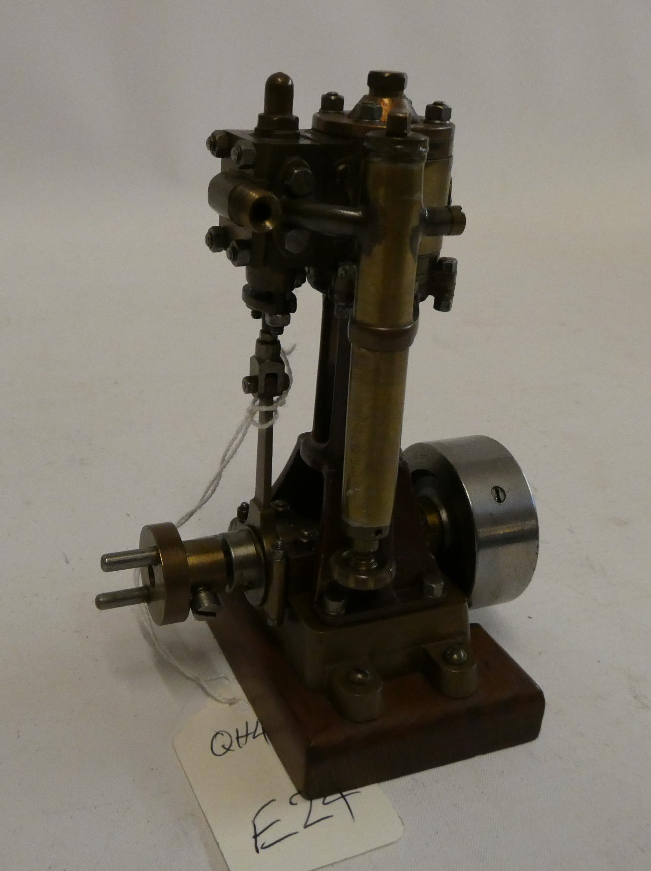 A single cylinder non-reversing vertical steam engine with maker's plate Morss of London to cylinder Image