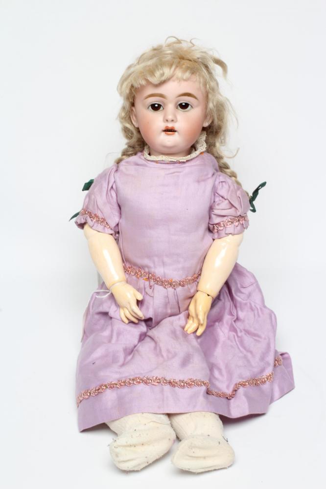 A bisque socket head doll, c.1900, with brown glass sleeping eyes, open mouth, teeth, pierced ears, Image