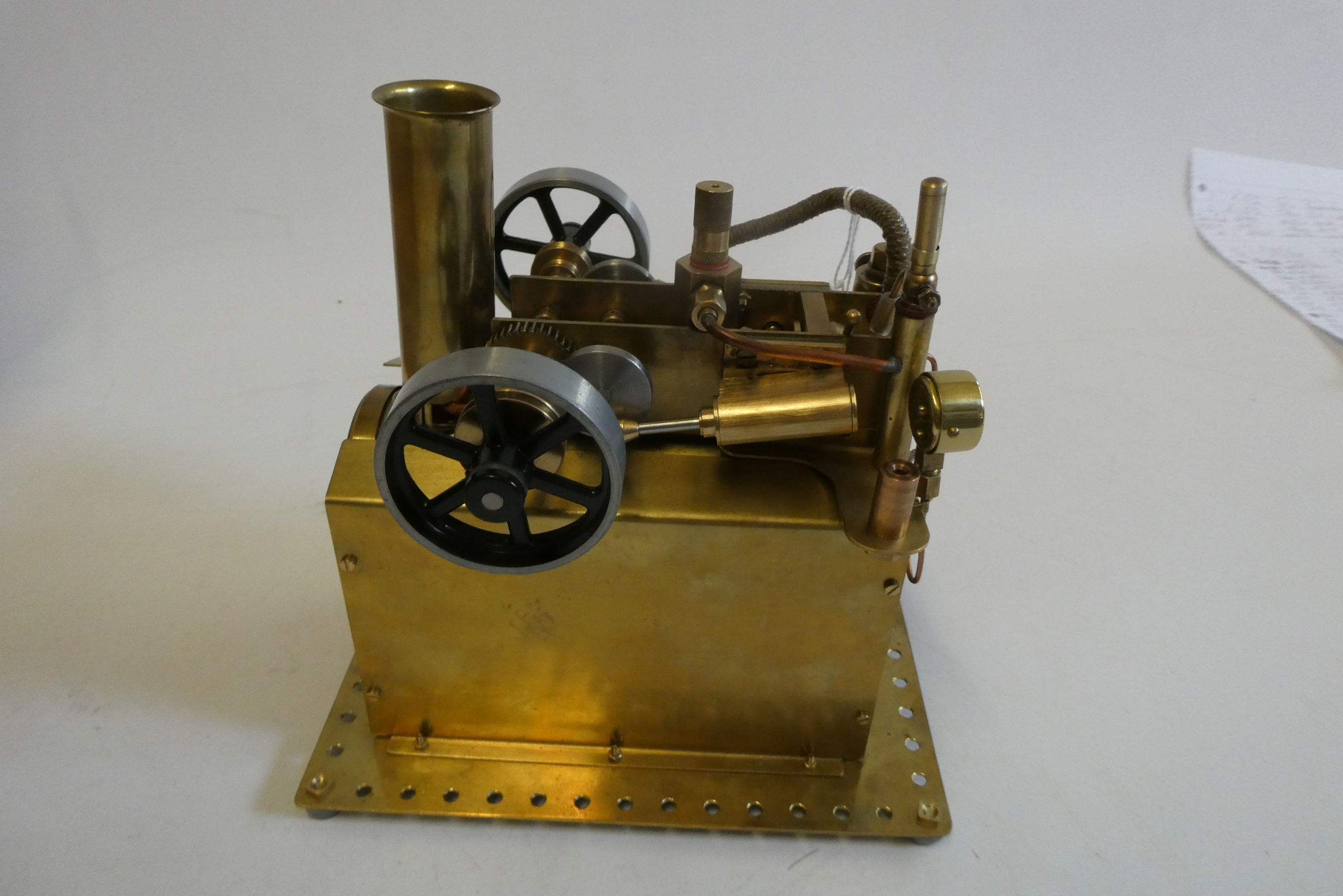 Brass twin cylinder over type steam engine, made using some Mamod parts, fitted with reversing Image