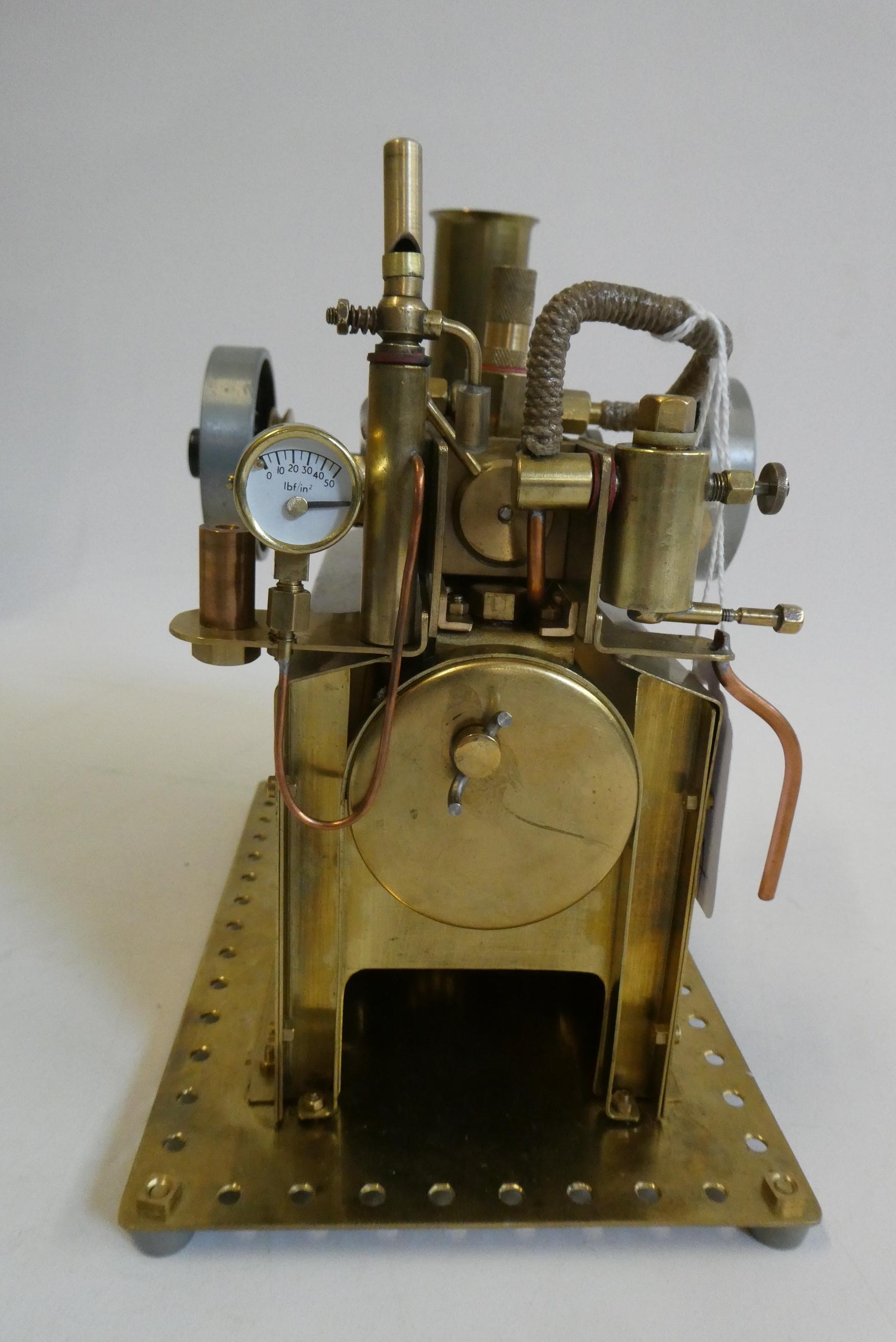 Brass twin cylinder over type steam engine, made using some Mamod parts, fitted with reversing Image
