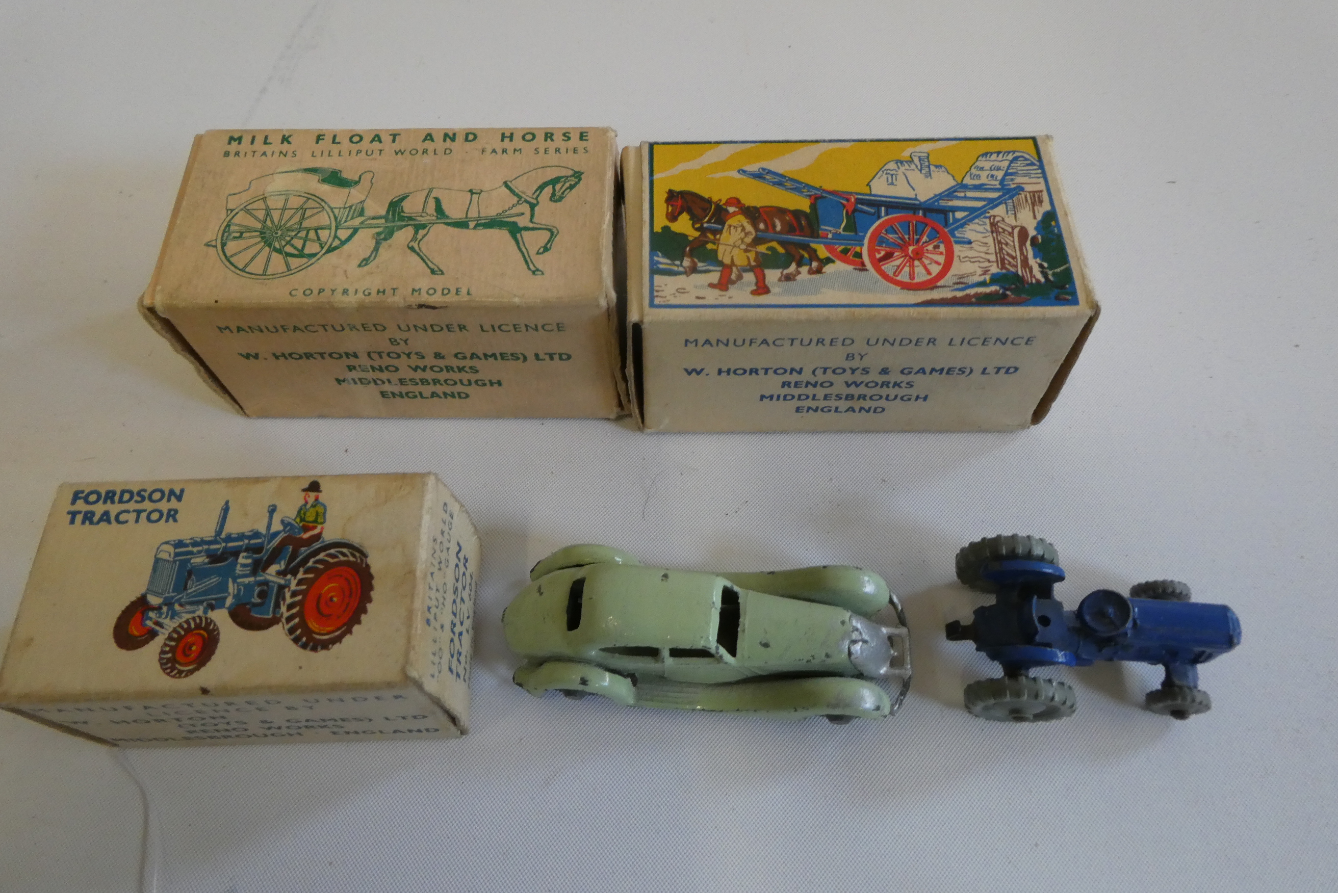 Britains Lilliput tractor, tumbrel cart and milk float, all items boxed, good to excellent, and a Image