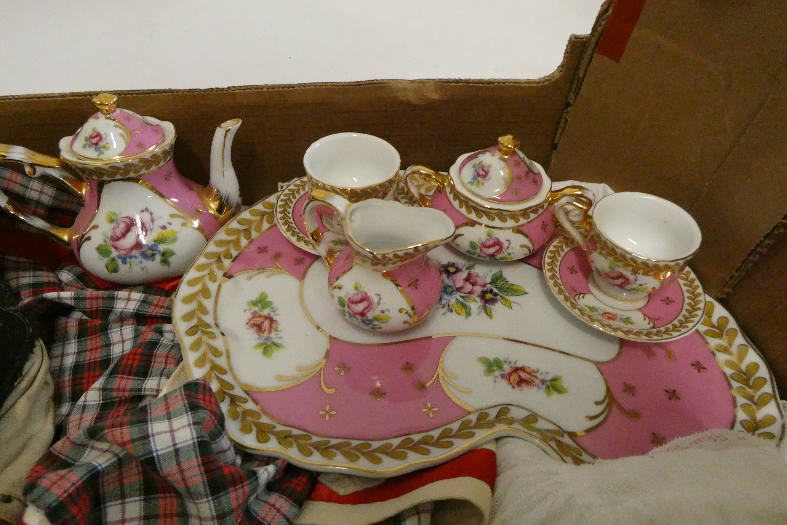 A box of dolls, clothing and accessories, including a pair of vintage composition head boys, a Image