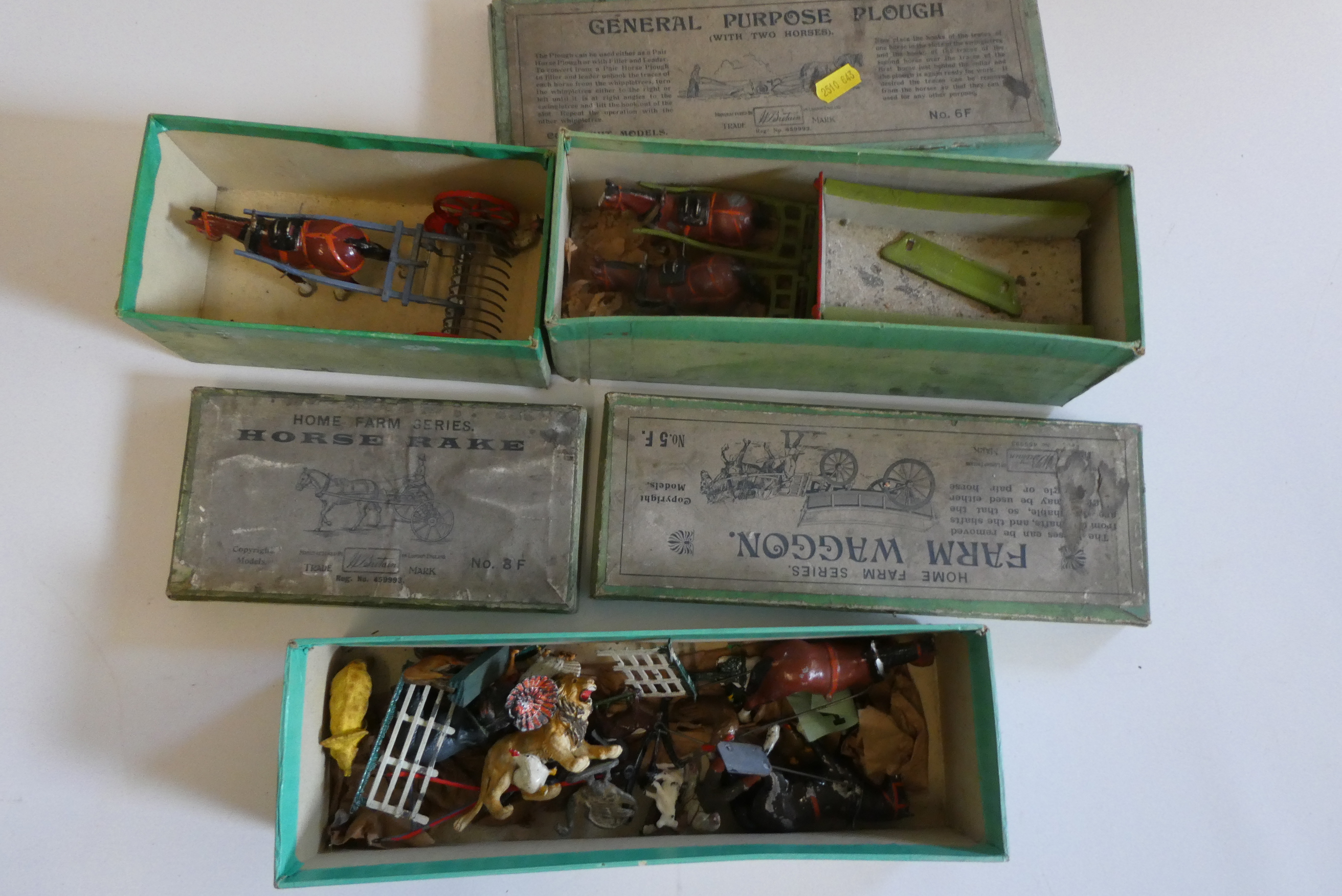 Britains Farm wagons comprising Horse Rake, general purpose plough and large farm wagon, some items Image