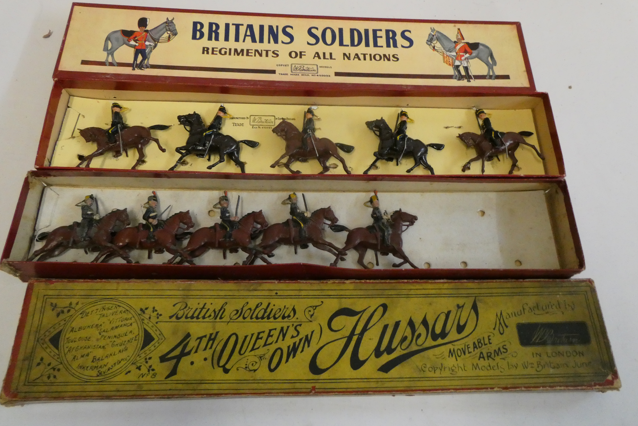 Two boxed sets of Britains Hussars on horseback, pre-war version, box fair, models fair, post-war Image
