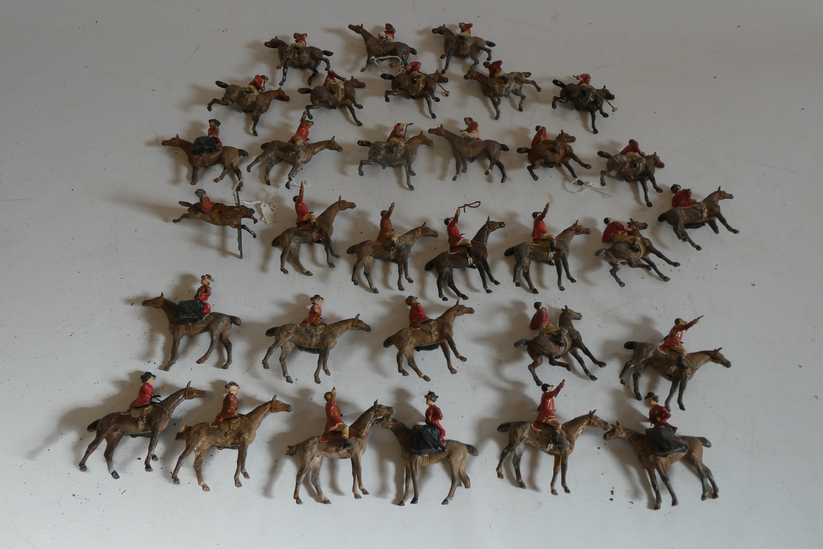 Large quantity of 55mm solid cast Hunt and Polo riders on horseback, most items have damage or paint Image
